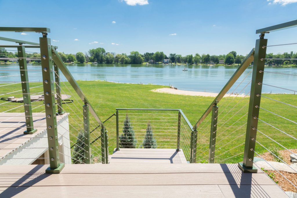 Exterior cable deck railing system with metal posts and metal railing